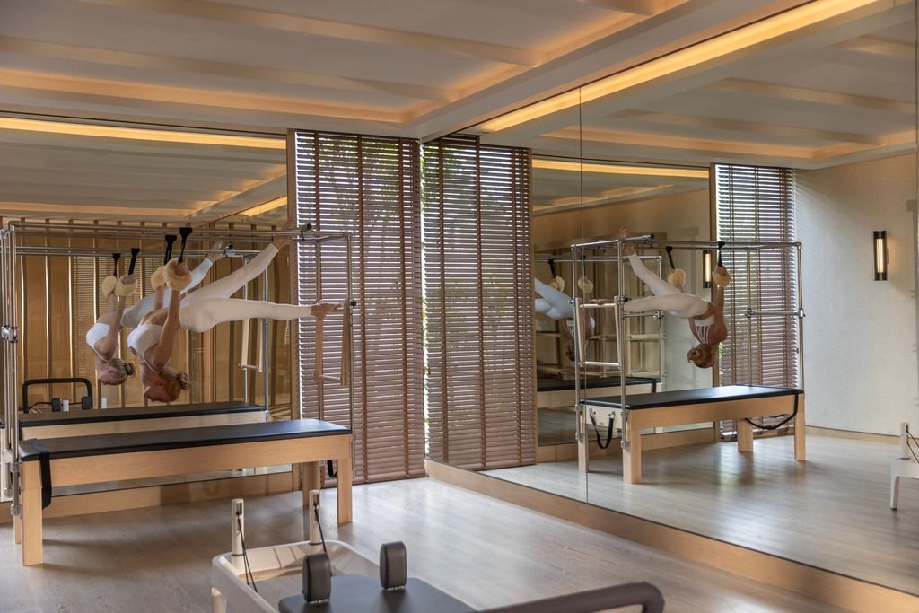 Copy of Layan Life by Anantara Pilates Room With Female Model scaled 1